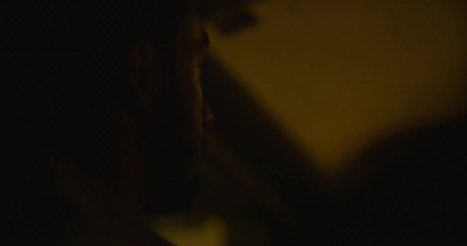 A man is driving his car at night