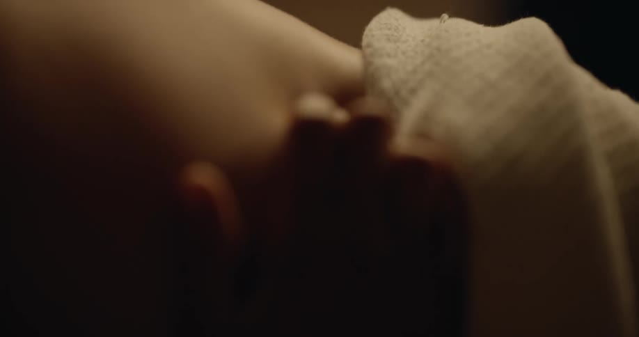 A couple make love in bed