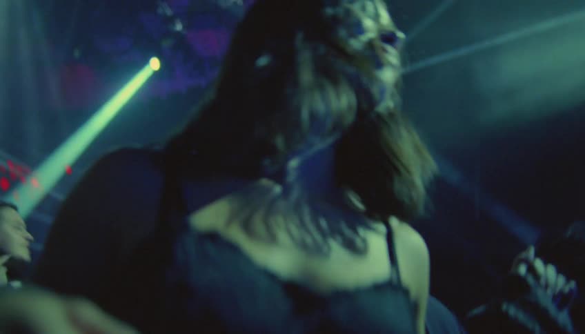 Woman and man dance in nightclub sweating