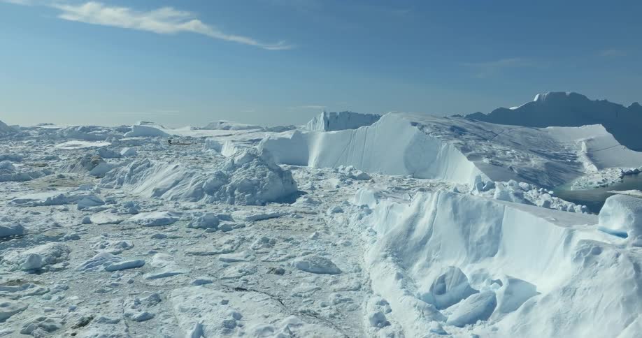 Icebergs in the ocean and on the shore