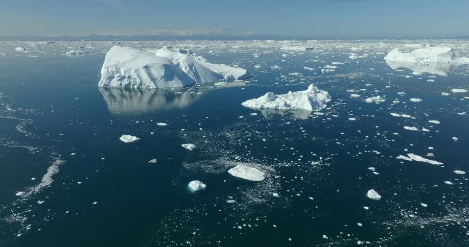 Icebergs jut out of the ocean