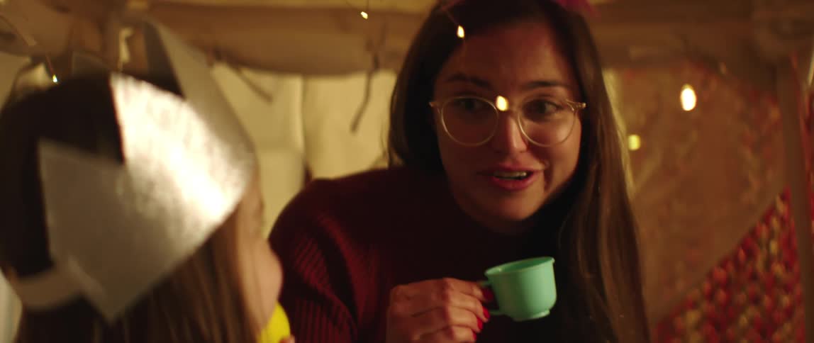 A mother and child have a tea party