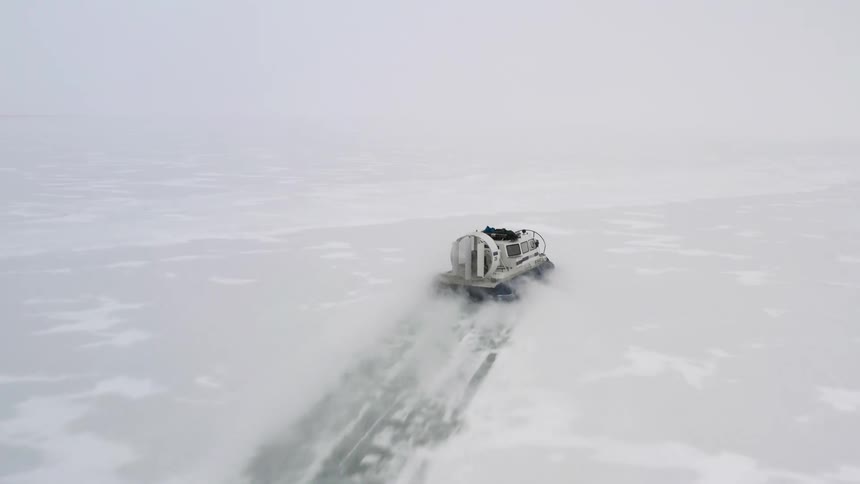 The hovercraft travels over the ice