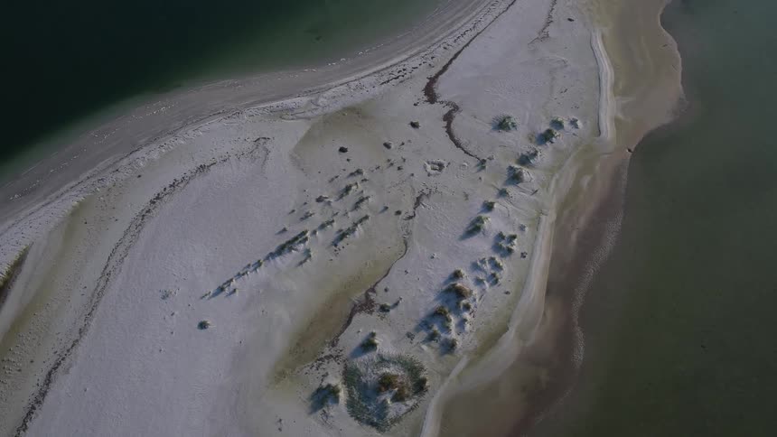 A small island is surrounded by water