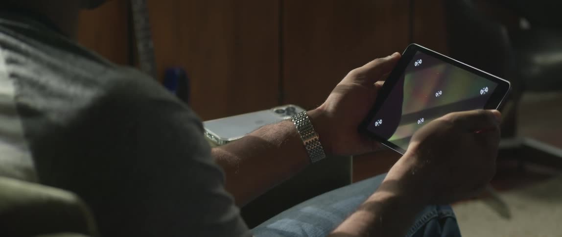 A person using a tablet in a room
