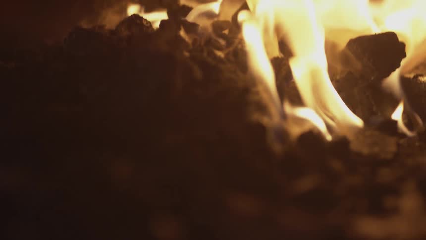 Coals are burning in a fire