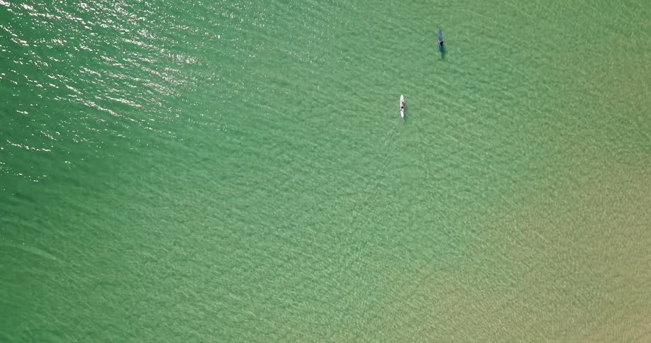 Aerial view of two people on kayaks in the ocean