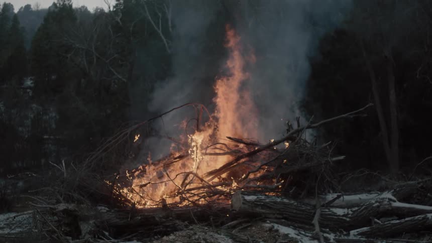 A large fire is giving off smoke