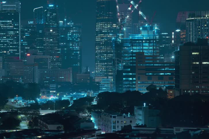 A wide skyscraper is built at night