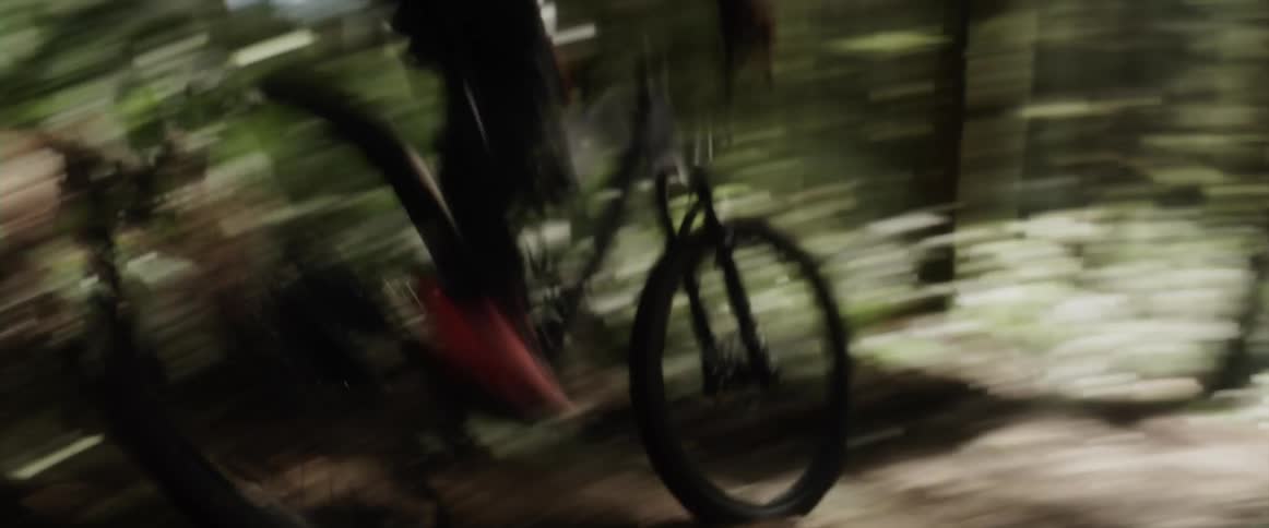 A man rides down fast on the bike