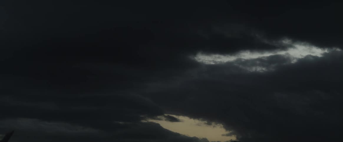 Storm clouds roll in and take over the sky