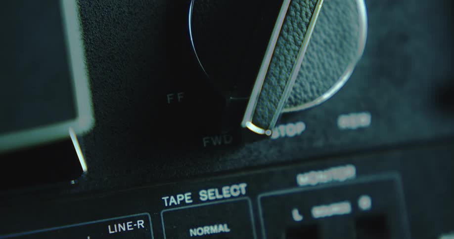 Close up of the knob and dials of a vintage tape recorder