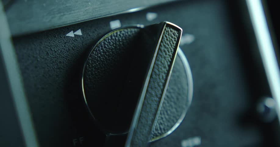Close up of a knob on the dial of a vintage music player