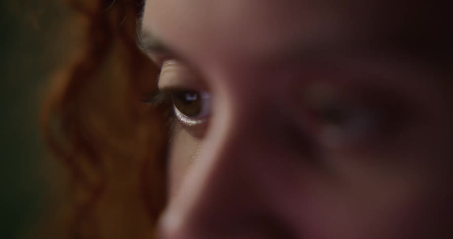 Close up of womans eyes looking into space
