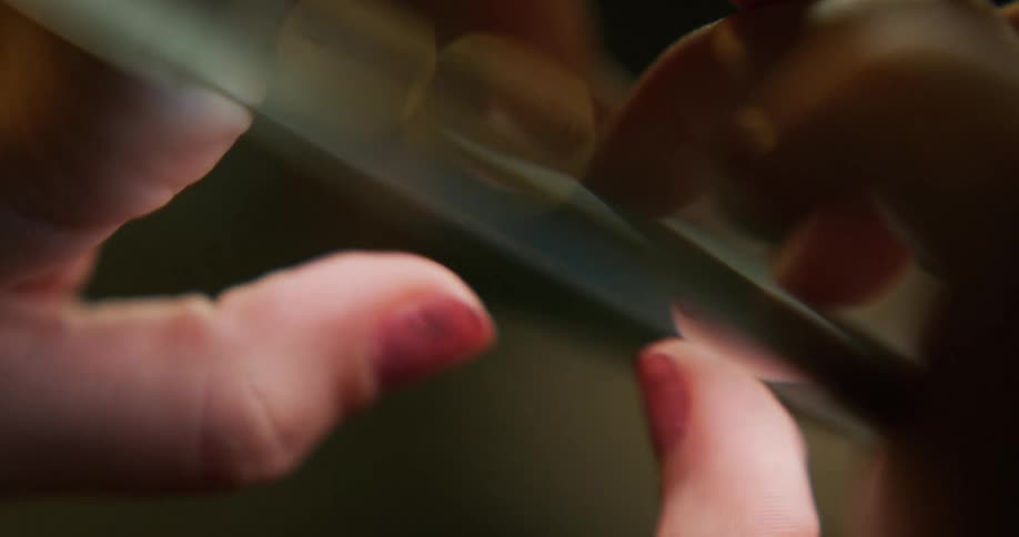 Close up of the hands of a woman texting on her smartphone