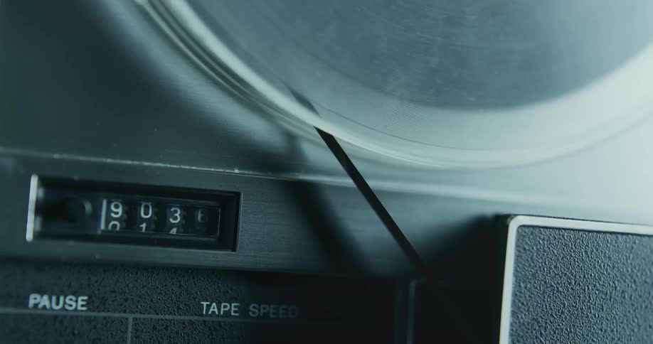 The numbers are stuck as the reel turns on an old reel to reel tape player