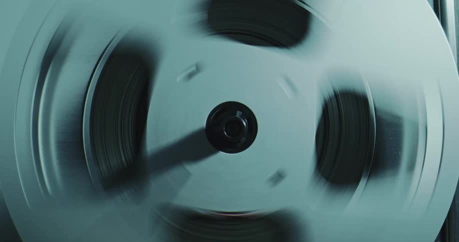 A film reel spinning rapidly
