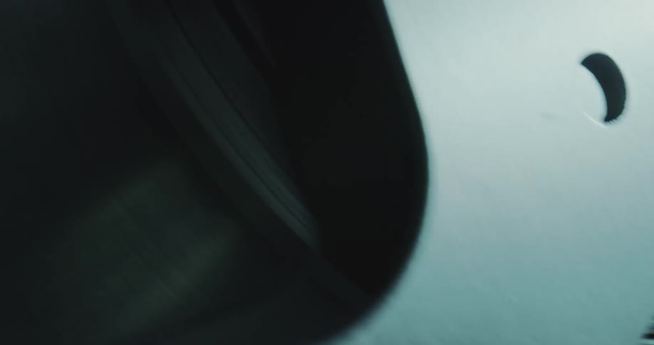 A reel turns showing tape or film inside