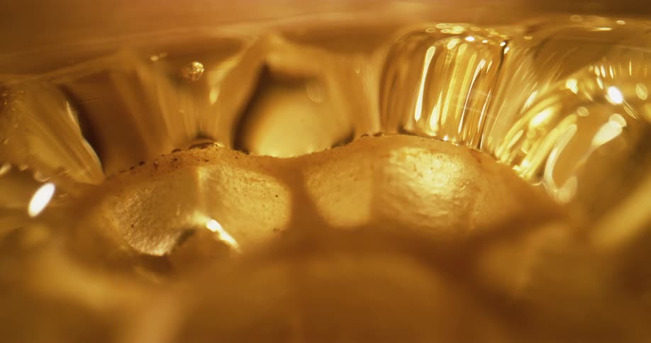 Close up of honeycomb with flowing honey