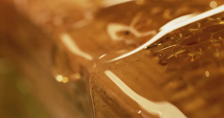 Close up of honeycomb with flowing honey