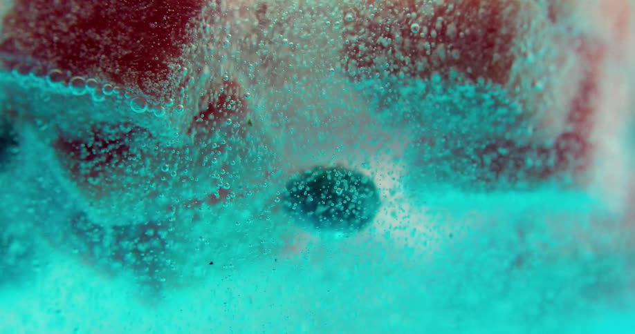 Fruit floating to the top of a carbonated beverage