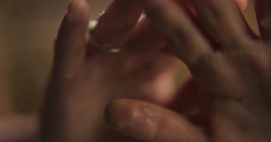 A womans hands moving slowly under the surface of water