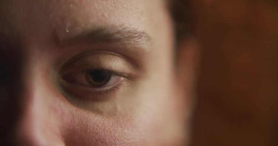 Close up of womans eye reflecting on water