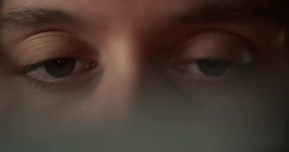 A womans eyes looking around and blinking