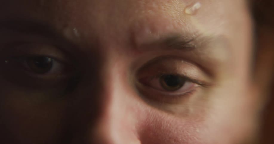 Close up of the eyes of a womans face submerged in water