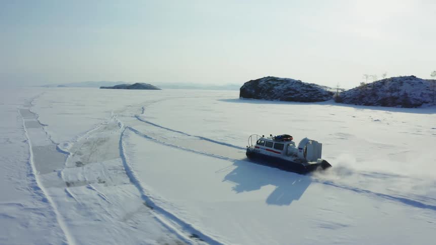 A vehicle is driving through an arctic area