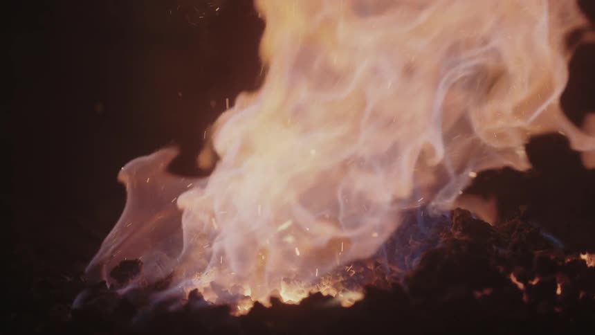A fire rages giving off sparks
