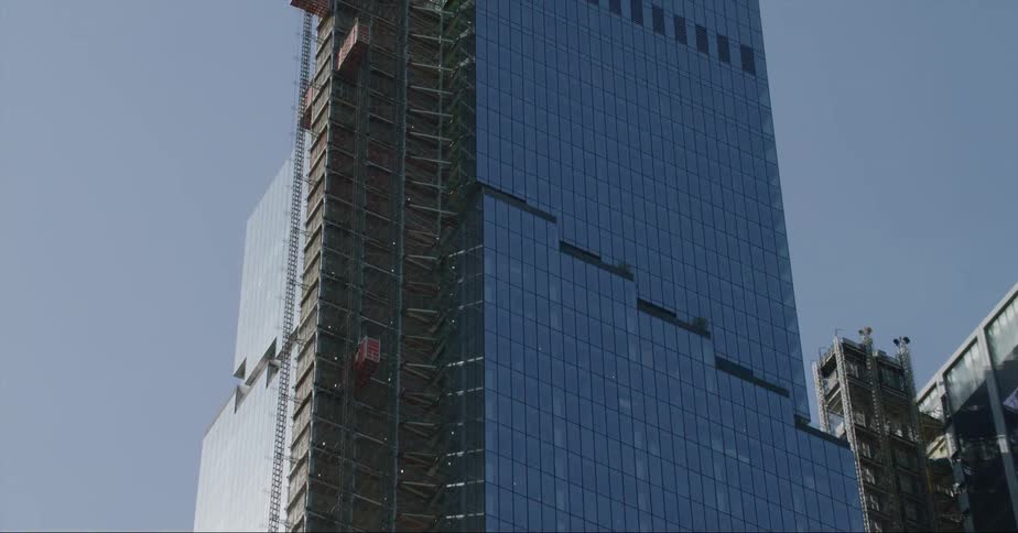 An office building in the city with construction on the outside