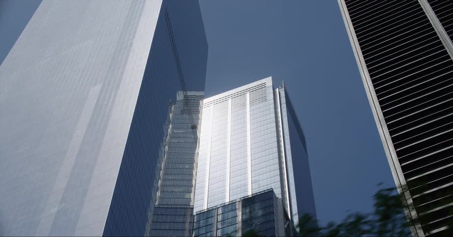 The sun is reflecting on the large buildings