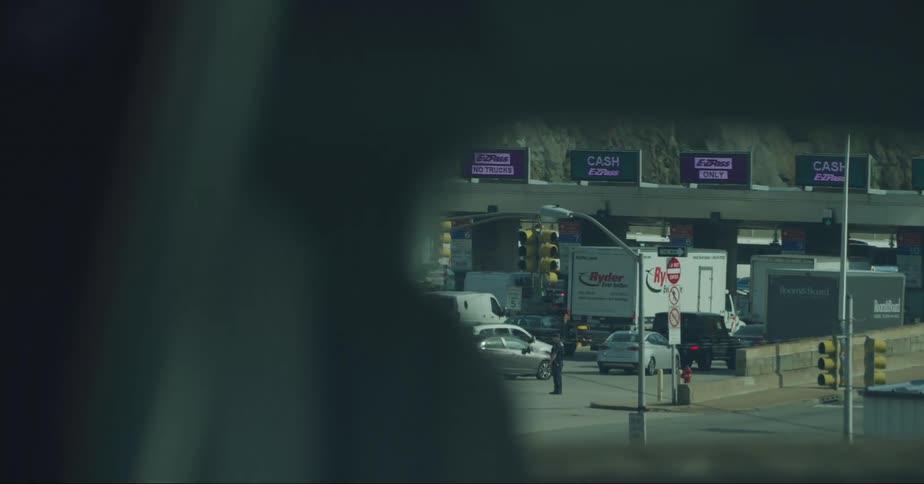 Traffic moves through the toll booths