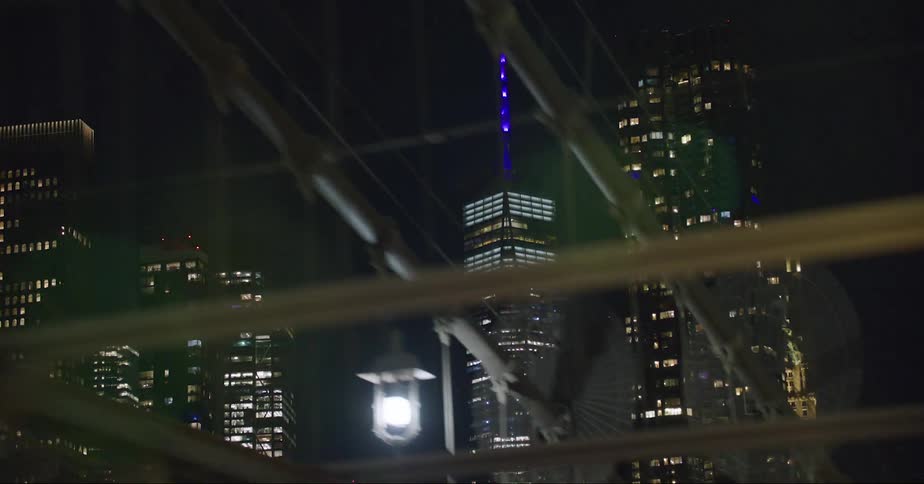 The buildings are brightly lit at night