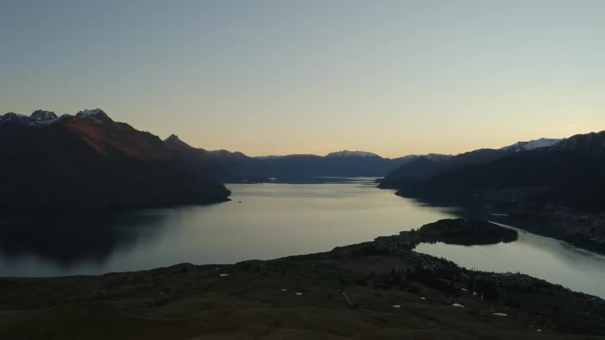 A calm mountain lake in nature at dusk