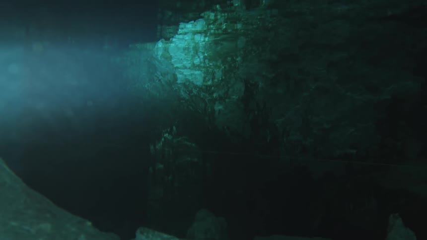 Rock formations and water in a cave