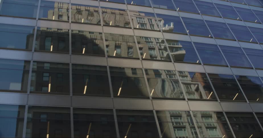 Exterior view of tall office building with windows in downtown