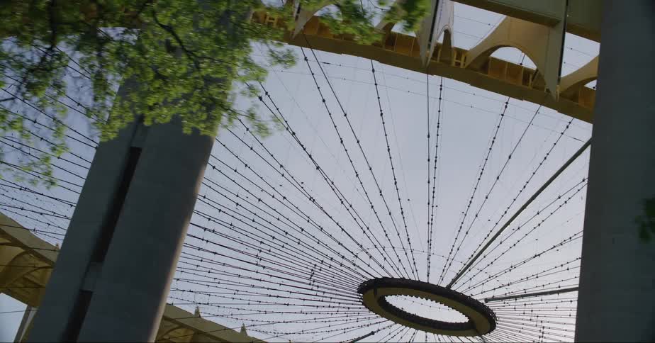 A circular structure in a city in the daytime