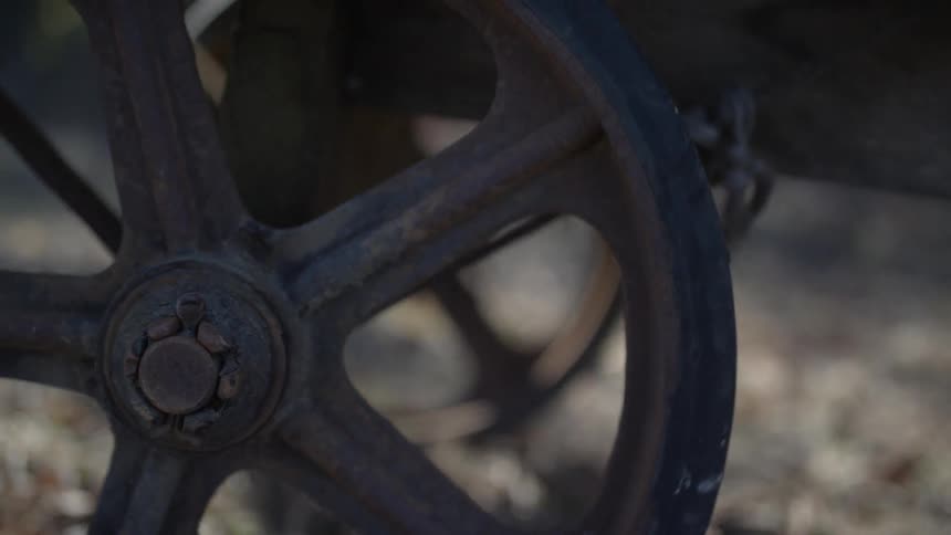 Wagon wheels turning as the wagon travels over rough ground
