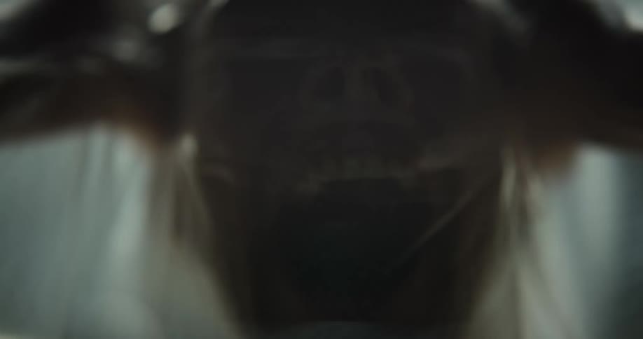 A person screams under the plastic