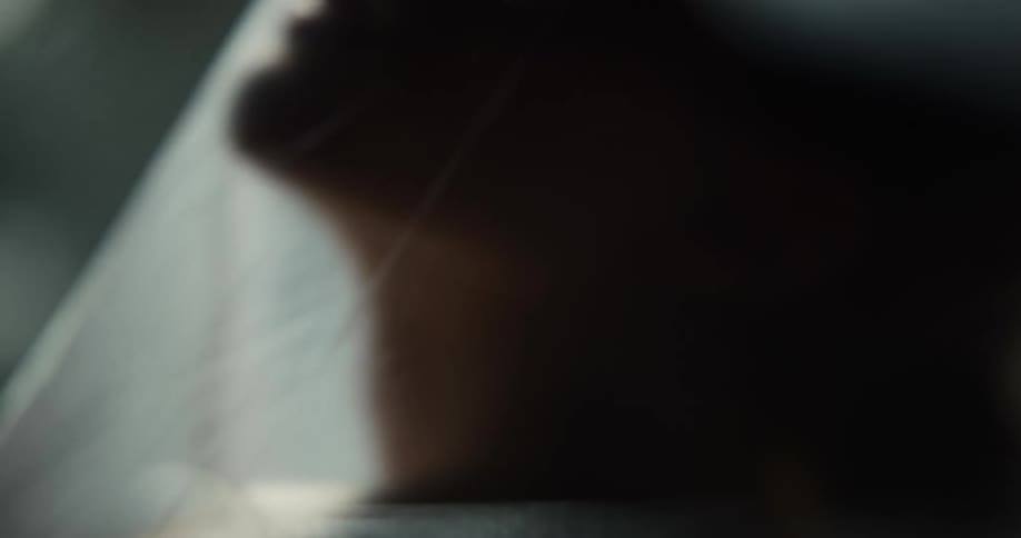 A person is stuck under a plastic sheet