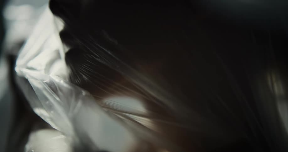 A woman is trapped under the plastic