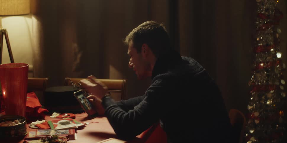A man is talking with someone on video call