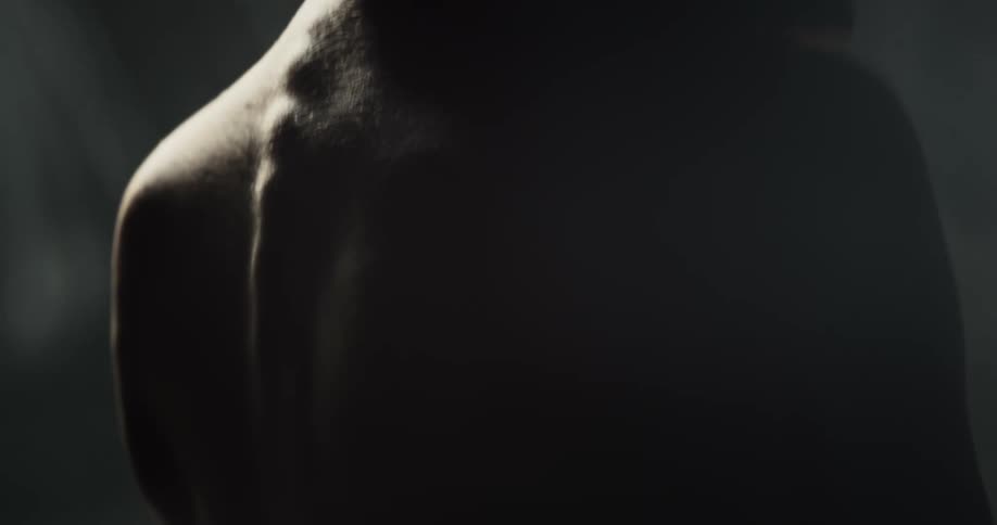 Topless womans back and silhouette in the studio