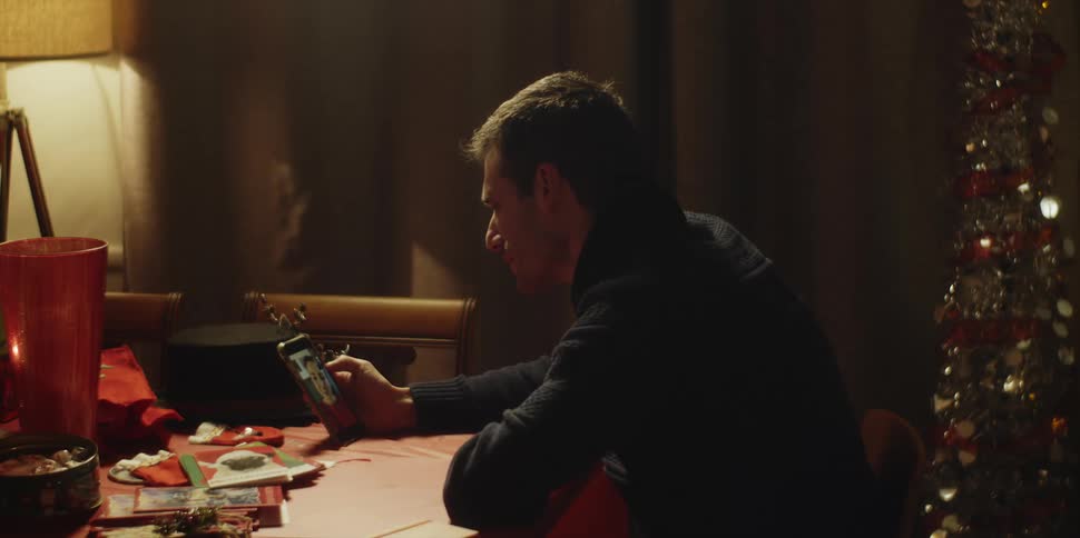 A man is talking on video with his cell phone