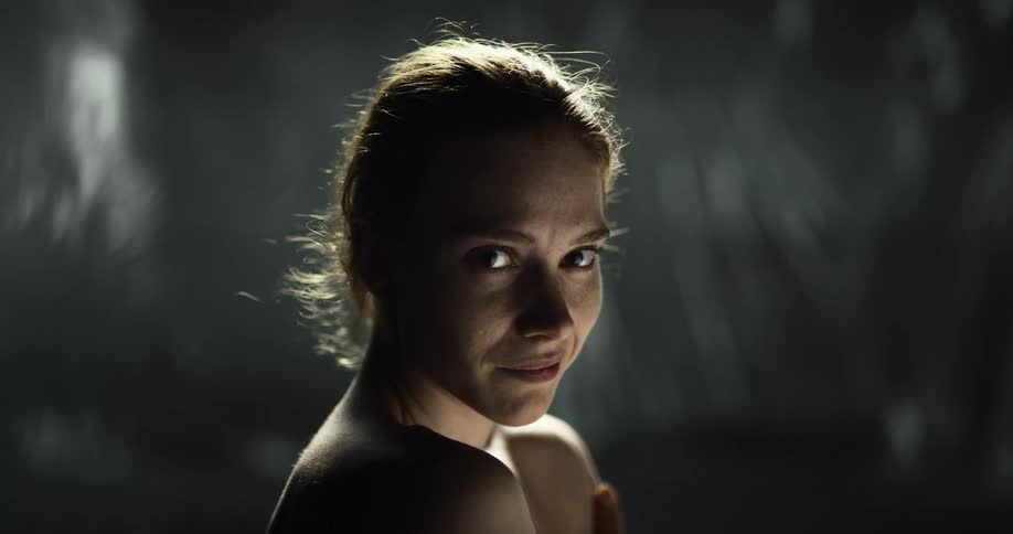 A portrait of a woman standing outdoors