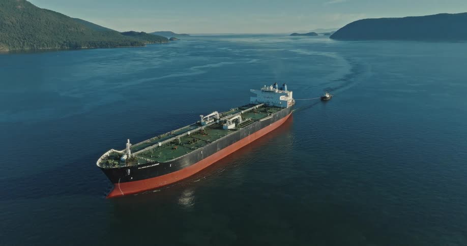 A ship is moving across the ocean water