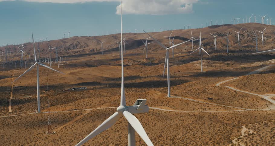 Aerial view of wind turbines on hilly wind farm