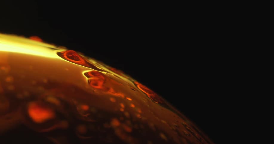 Abstract footage of liquid melting on a sphere